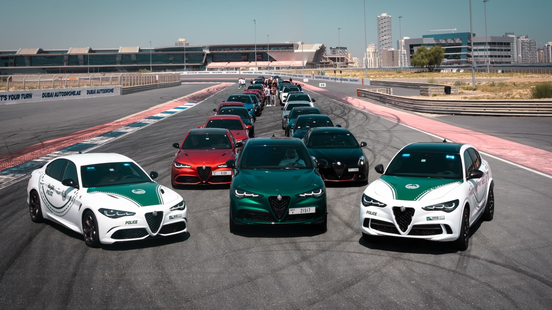 Fleet of Alfa Romeo vehicles including Dubai Police Giulias at Dubai Autodrome